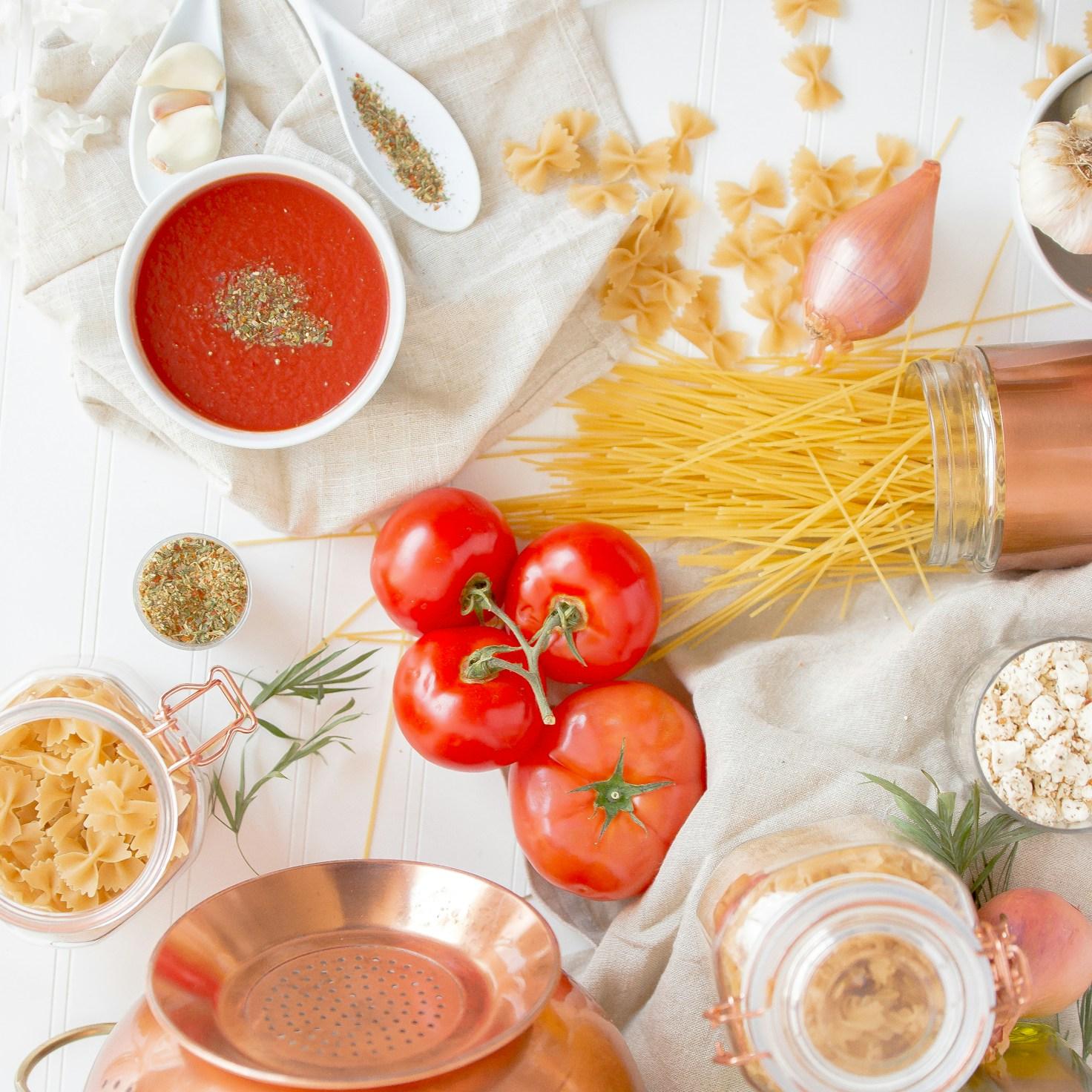 Community members collaborating in a contemporary kitchen, exchanging recipes and techniques